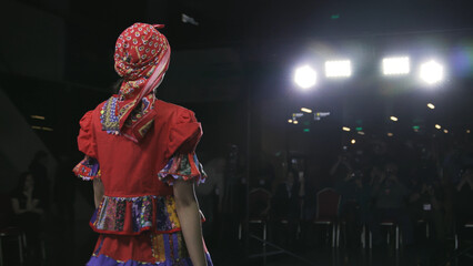 Fashion slavic design female clothe folk woman podium slow motion stage. Defile beautiful ethnic...