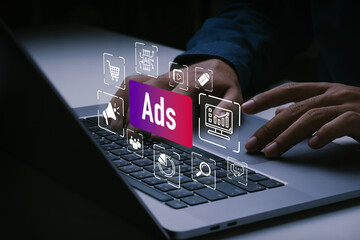 Ads concept. Digital marketing strategy analysis and Goals, online sale concept.Man using laptop...