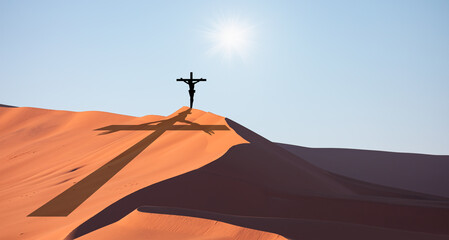 Jesus on the cross top of the sandune 