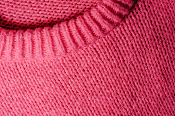 Close Up of Pink Sweater With Hole in the Middle