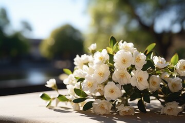 White jasmine flower branch on a coffin close up in funeral ground