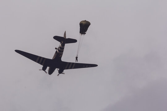 ARNHEM, NETHERLANDS SEP 20, 2014: Paratroopers jumping from a C-47 Skytrain
