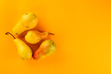 pears on a yellow background.