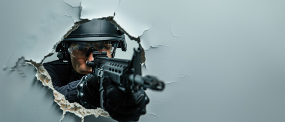 A special operations agent is poised with a gun in a strategic position within a torn wall, denoting stealth and strategy