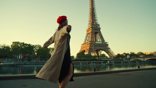 Joyful Person Walking by the Eiffel Tower