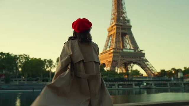 Person with Red Beret near Eiffel Tower at Sunset