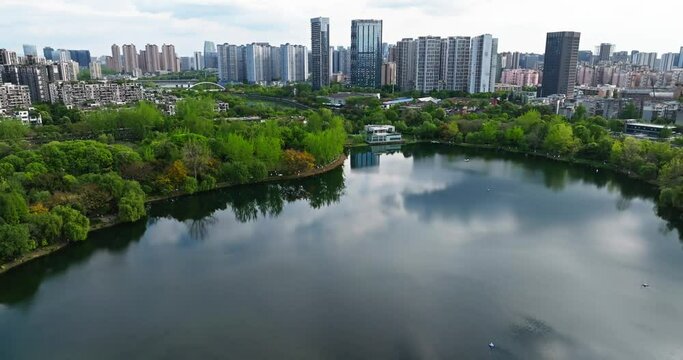 Beautiful Chengdu aerial Cityscape at spring Cloudy day with lake river park and lush woods