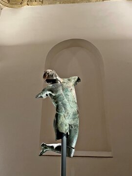 close-up of the original bronze statue of the "Dancing Satyr" fished out of the seabed of Sicily and dating back to the years before Christ in Mazara del Vallo, Sicily, Italy