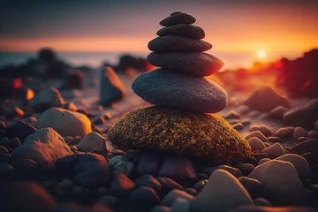 Tuinposter Stack of zen stones on the beach at sunset © marikova