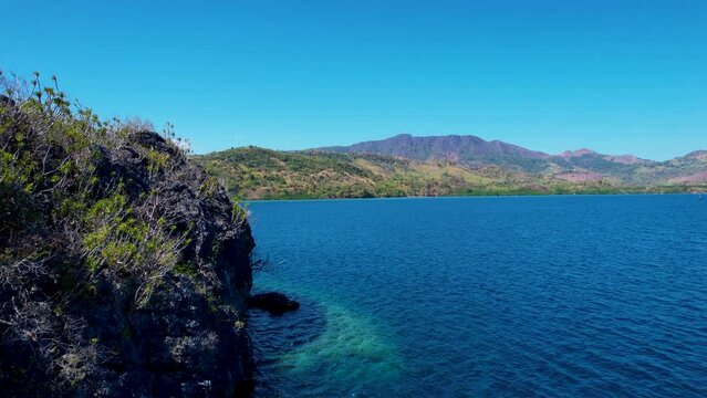 4K Aerial drone video of Siete Pecados Siete with boats surrounded by blue sea. Coron, Palawan. Philippines.