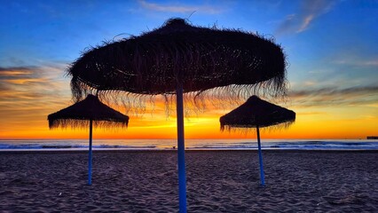 Red sunrise on the beautiful Cabanyal beach