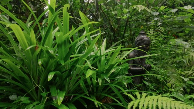Statue of rice farmer mystic in garden. Ubud, Bali, Indonesia.