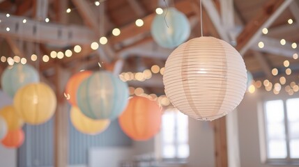 Paper lanterns hanging indoors with twinkling fairy lights for a festive celebration.