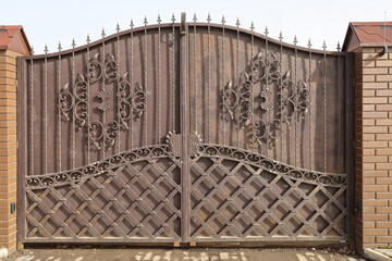Wrought iron closed gate with patterns, textured surface, Film grain effect