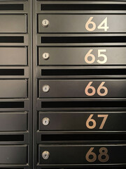 Array of Mailboxes With Numbered Labels