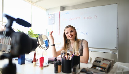 Woman blogger conducts makeup training remotely. Online courses in skin care concept