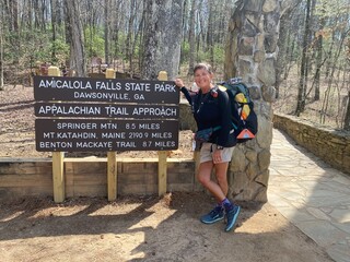 Middle aged female hiker at the start of the Appalachian Trail in Georgia
