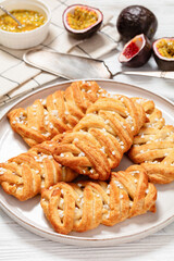 passion fruit puff pastry turnovers on a plate