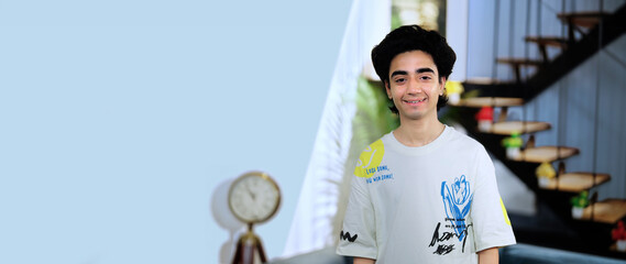 Indian Asian Hindu happy teen age cool boy smiling expert look cam pose video indoor home. gen z...