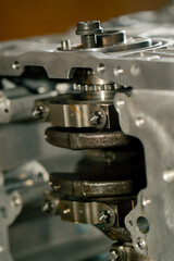 Fototapeta na wymiar close up The crankshaft set of pistons close-up on desktop of an auto mechanic Spare parts of the car suspension