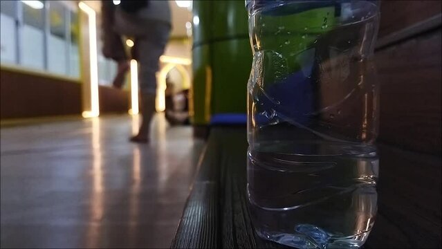 Prayer in mosque for adzan vidio klip or for your muslim business and bottle of water