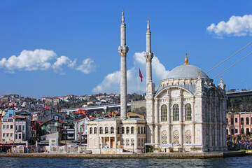 Fototapeta na wymiar Beautiful view from the sea of Ortakoy Mosque at afternoon facing the Bosphorus canal, Istanbul, Turkey