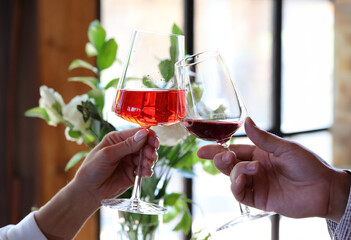 glasses of wine in hands holiday, meeting of friends - 781415719