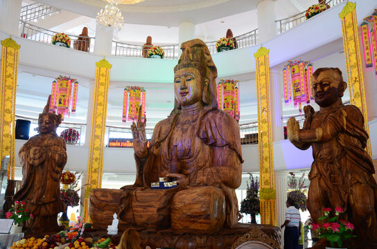 Carving wooden Quan Yin or wood Kuan Yin chinese goddess for thai people travelers travel visit respect praying wish blessing at Wat Huay Pla Kang temple on February 24, 2015 in Chiang Rai, Thailand