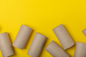 Empty toilet paper roll. Empty toilet paper rolls for the toilet, on a bright yellow background....