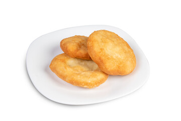 A plate of Jamaican or Trinidadian deep fried dumplings isolated on white