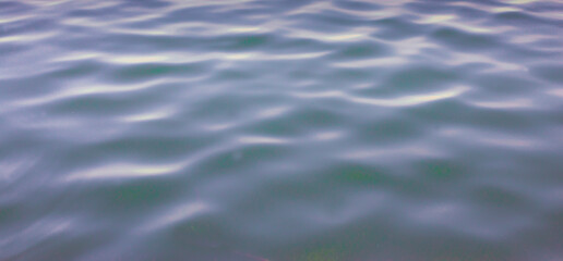 Image of a smooth, naturally moving water surface.