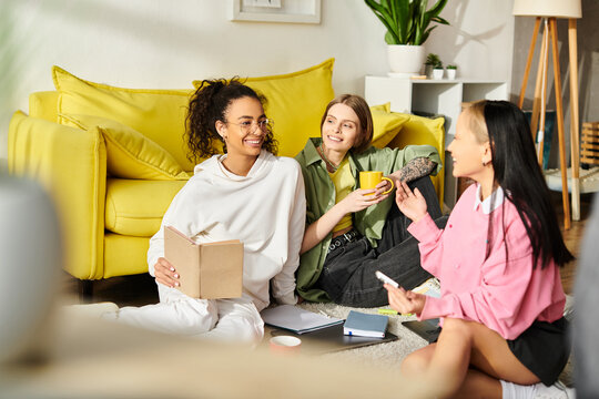 A diverse group of teenage girls engage in deep conversation while sitting on a cozy couch at home. - Powered by Adobe
