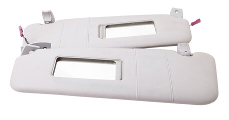 Sun visor with a mirror made of light gray plastic on a white background in a photo studio. Spare part of the car interior for replacement in a car service or for sale on auto dismantling.