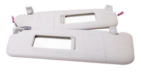 Sun visor with a mirror made of light gray plastic on a white background in a photo studio. Spare part of the car interior for replacement in a car service or for sale on auto dismantling.