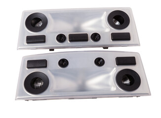 A  transparent plastic shade for illuminating the interior on a white isolated background in a photo studio - spare parts for repairing a car interior or for sale in a auto service.