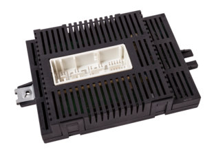 Plastic car engine control unit with metal elements on a white isolated background is the connecting center of various subsystems, units and assemblies. Monitoring the state of the moment. Spare part