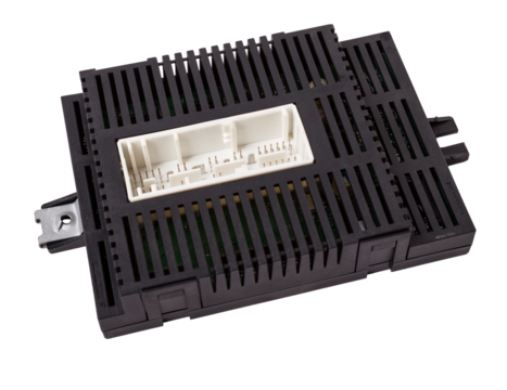 Plastic car engine control unit with metal elements on a white isolated background is the connecting center of various subsystems, units and assemblies. Monitoring the state of the moment. Spare part