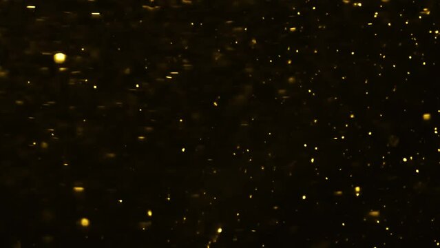 4K Gold Explosion effect. Festive Fireworks. Isolated on black background. Floating golden sparkles. Glowing Particles. Overlay. 60 fps