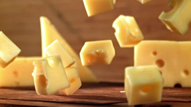 Super slow motion pieces of cheese. High quality FullHD footage