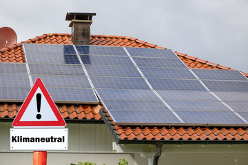 A photovoltaic solar power plant in Sauerland with the sign 