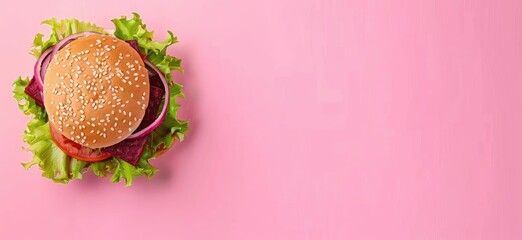 A delectable veggie burger with beetroot, lettuce, and onion, topped with sesame seeds on a vibrant pink background. - obrazy, fototapety, plakaty