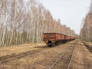 Peat train cars on the railway in drained bog