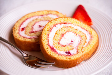 Swiss roll with strawberries and cream, homemde dessert - 781462554