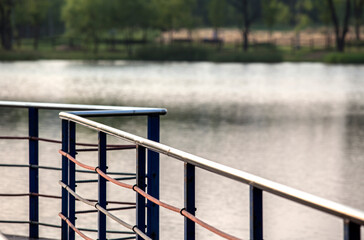 The guardrail on the bridge in the lake