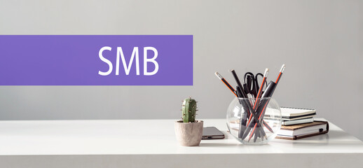 Wood letter of SMB abbreviation with hand writing definition
