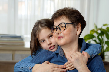 Cute little girl hug her grandmother show love and affection, - 781467152