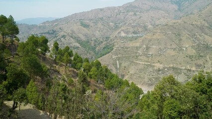 Explore the majestic beauty of deep valleys and mountain landscapes in Thatyur Village, Tehri Garhwal, Uttarakhand, India. A captivating tourist destination offering breathtaking natural vistas.