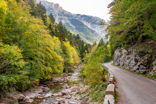 Valle de Hecho, Huesca, Spain. Wooden bridge over the river Aragon Subord&aacute;n in Selva de Oza.