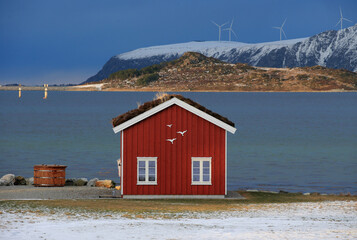 Winter landscape with red boathouse near Alesund, Norway. - 781469366