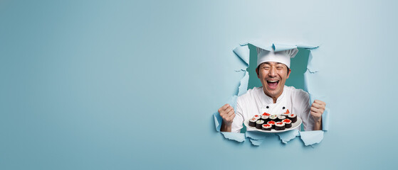 A joyous chef in white attire pops through a torn blue backdrop holding delicacies